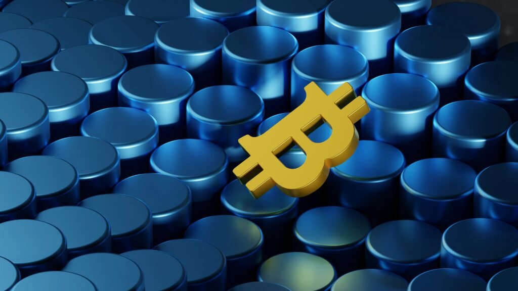 Gold Bitcoin symbol on blue geometric background