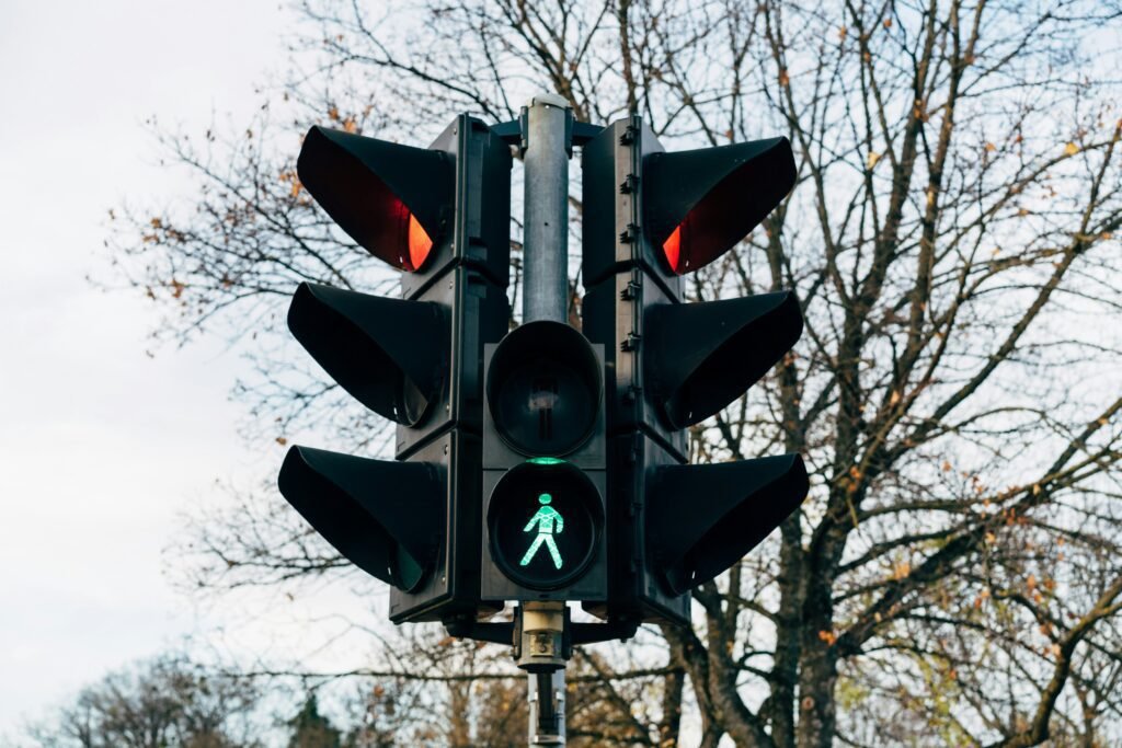 Traffic light with green pedestrian signal, symbolizing progress and innovation in cryptocurrency.