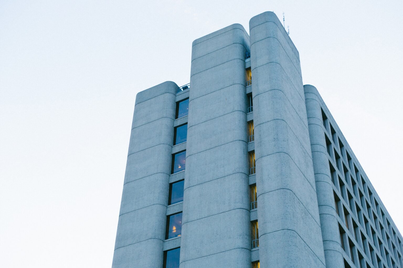 Modern office building with large windows, representing the financial sector and cryptocurrency innovation