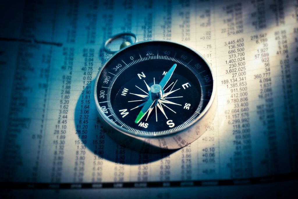 Compass on financial data representing direction in cryptocurrency investments