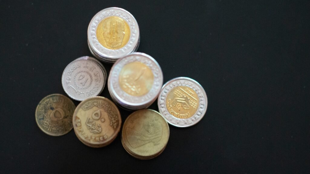 Stack of Egyptian coins on a dark background
