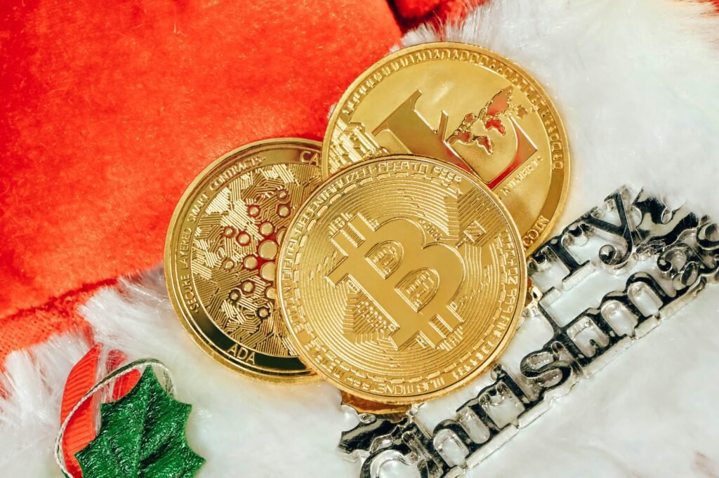 Cryptocurrency coins including Bitcoin and Litecoin in a festive Christmas setting